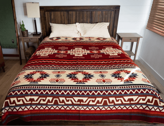 Red and Cream alpaca blanket on bed