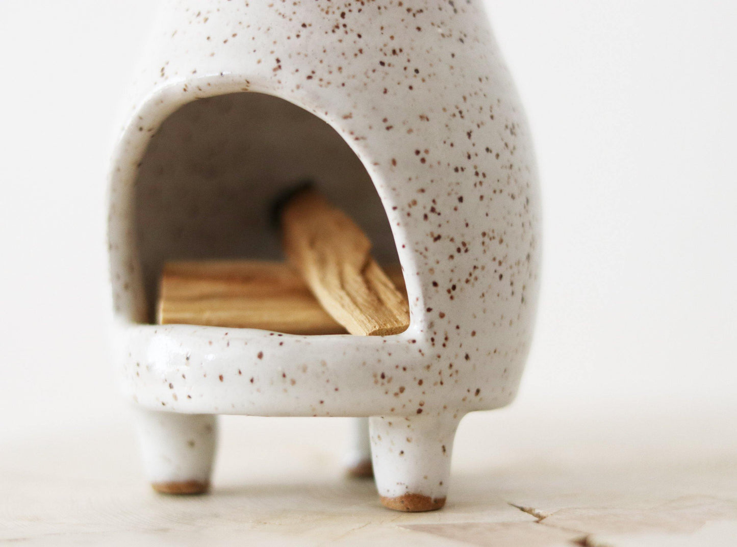 White speckled ceramic chiminea. Perfect for incense, palo santo or a tea light candle.