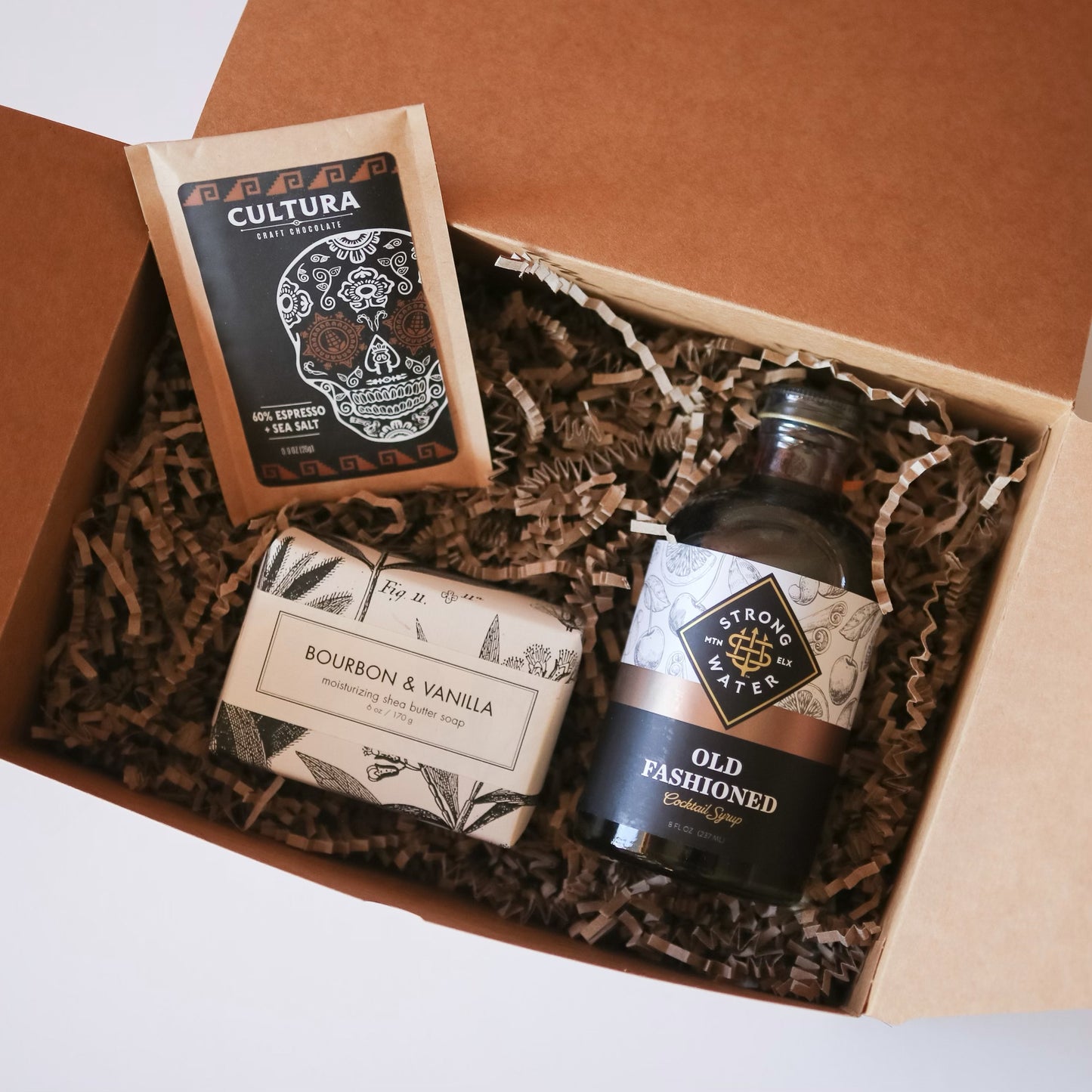 Gift box with chocolate, cocktail mix, and soap.