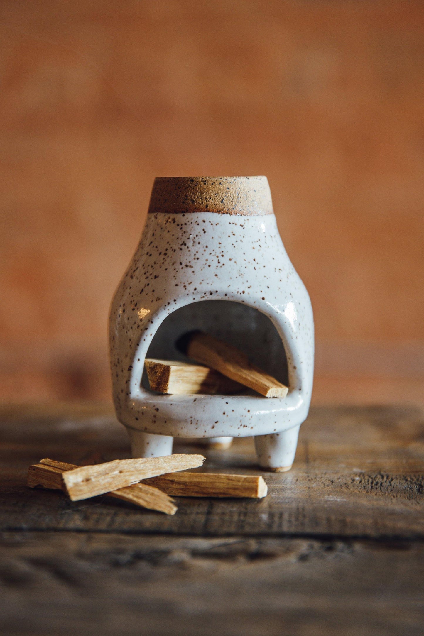 White speckled ceramic chiminea. Perfect for incense, palo santo or a tea light candle.