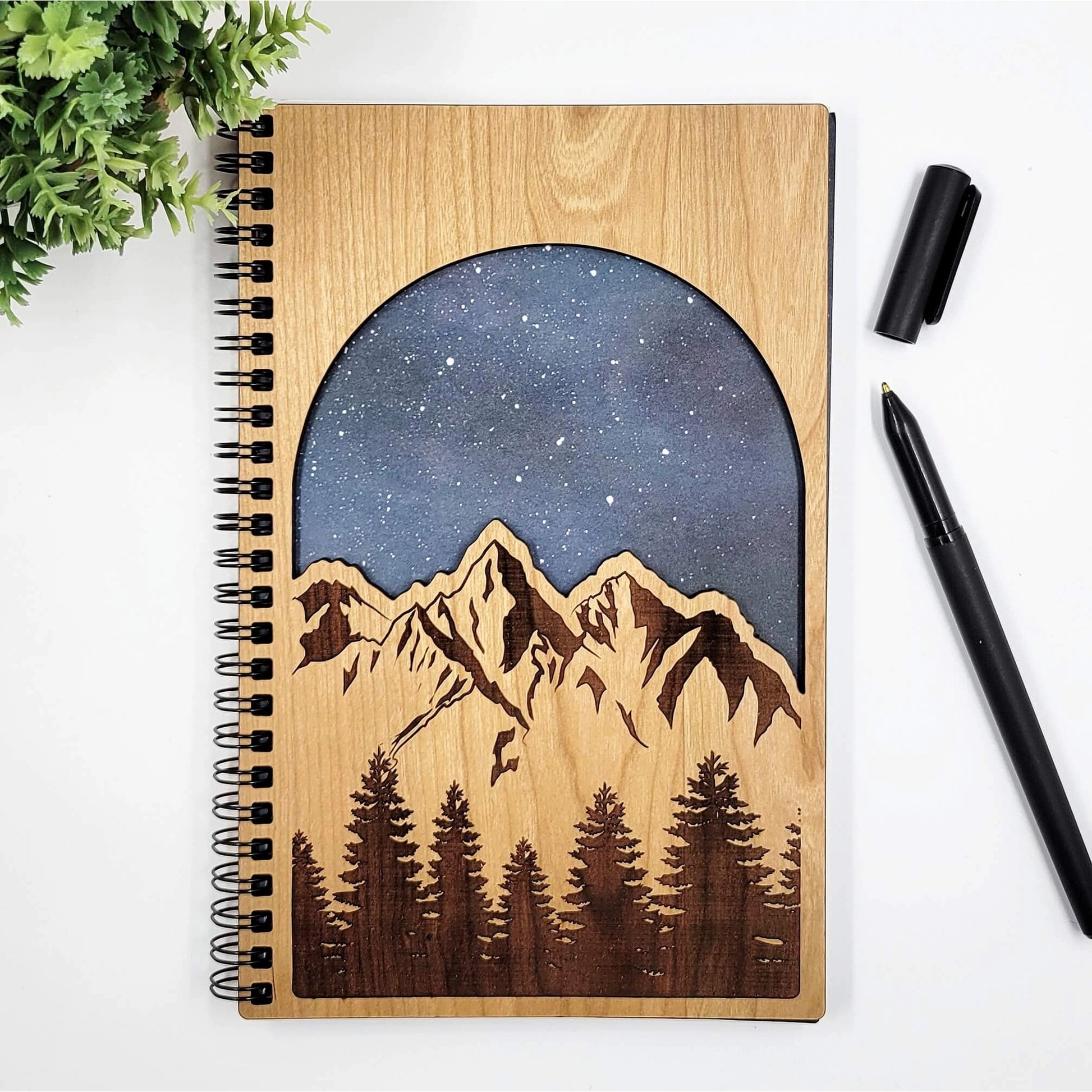 wood journal with mountains and starry sky