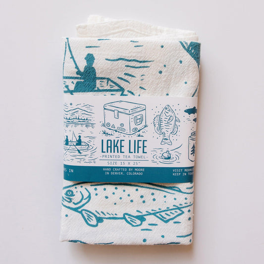 Lake Life printed tea towel with blue lake-themed illustrations