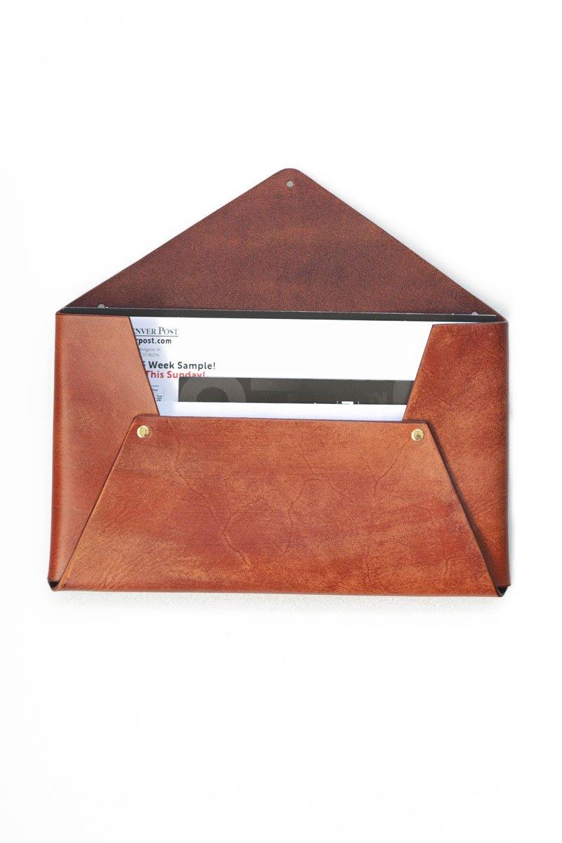 Leather wall-hanging mail holder. Brown handmade leather wall pocket