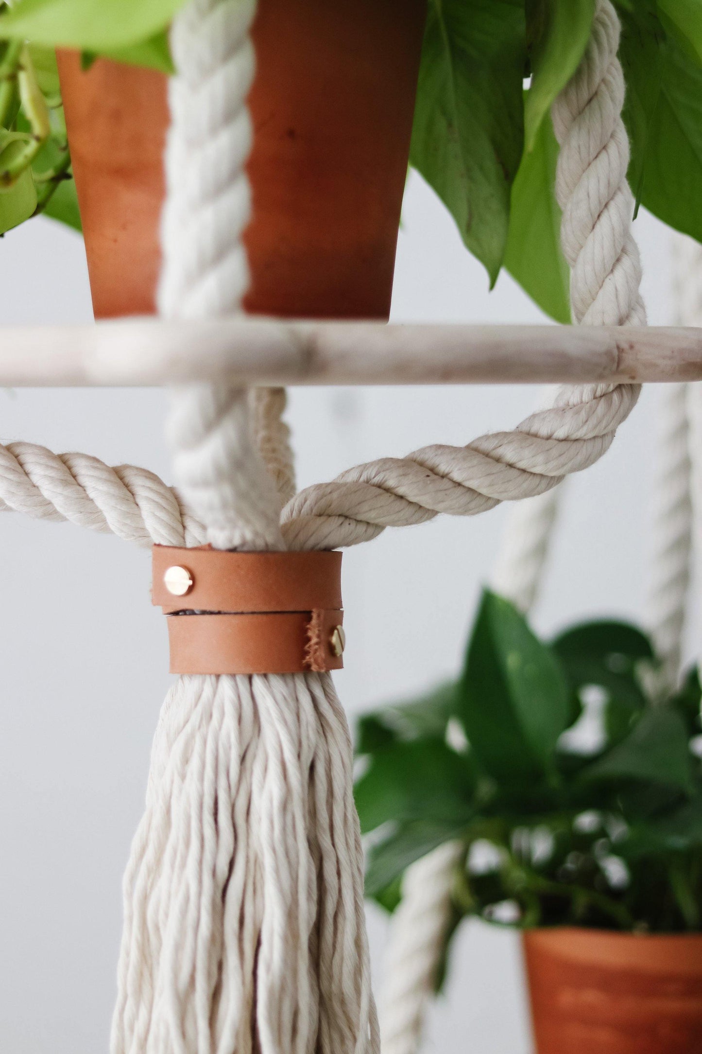 hanging planters with wood and leather