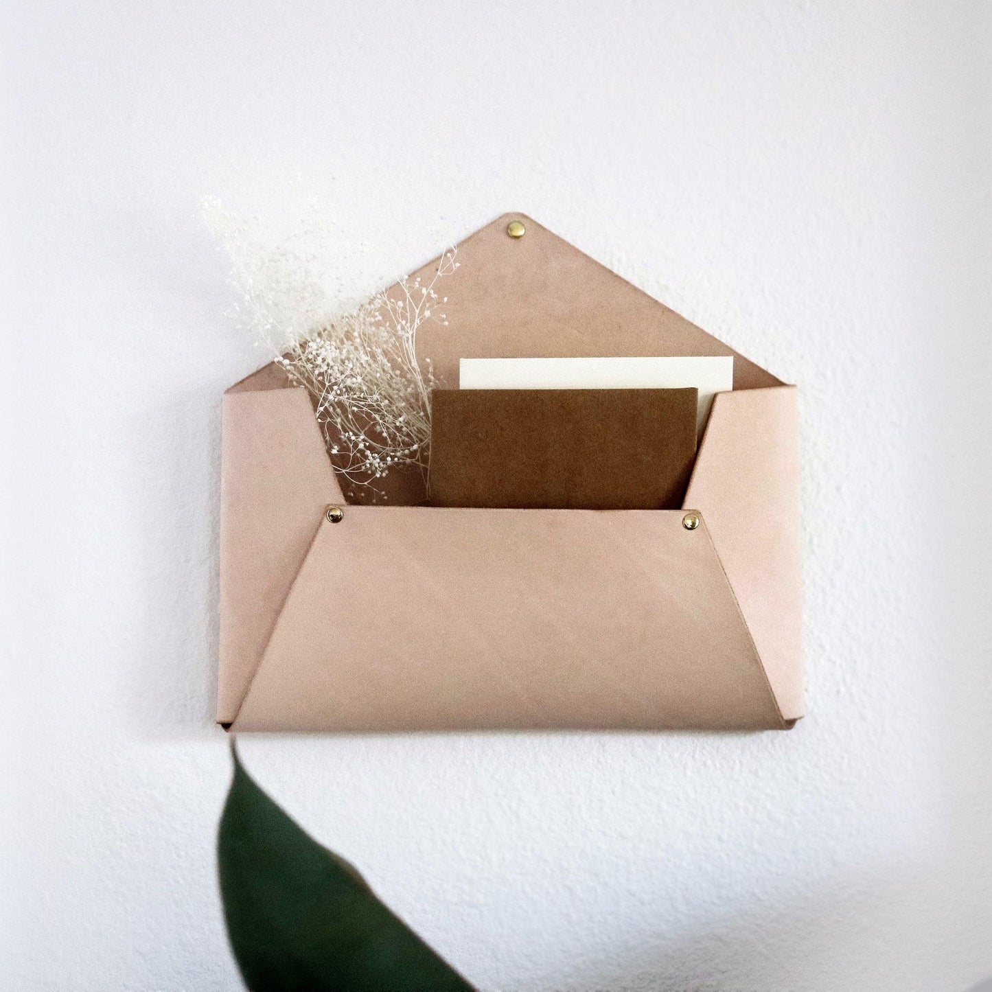 Leather wall-hanging mail holder. Beige vegetable-tanned handmade leather wall pocket